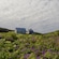 2 small houses in a countryside covered with flowers